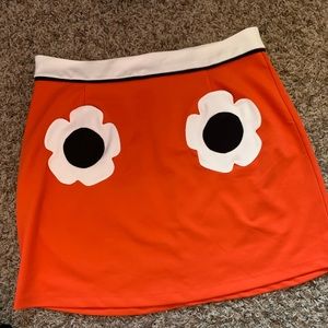 Orange mini skirt with flower pockets